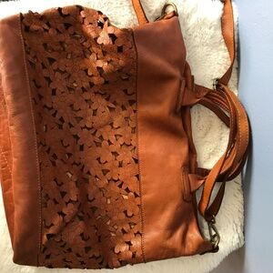 Leather cut work tote by Sundance